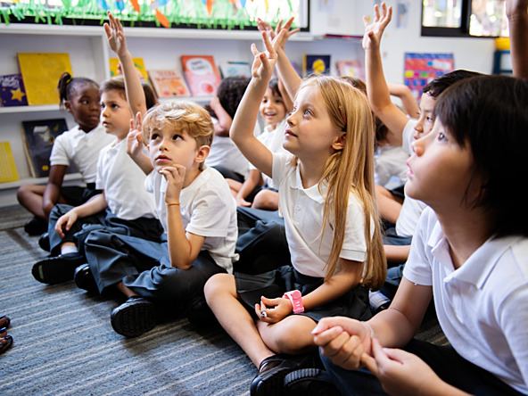 Children asking questions at school
